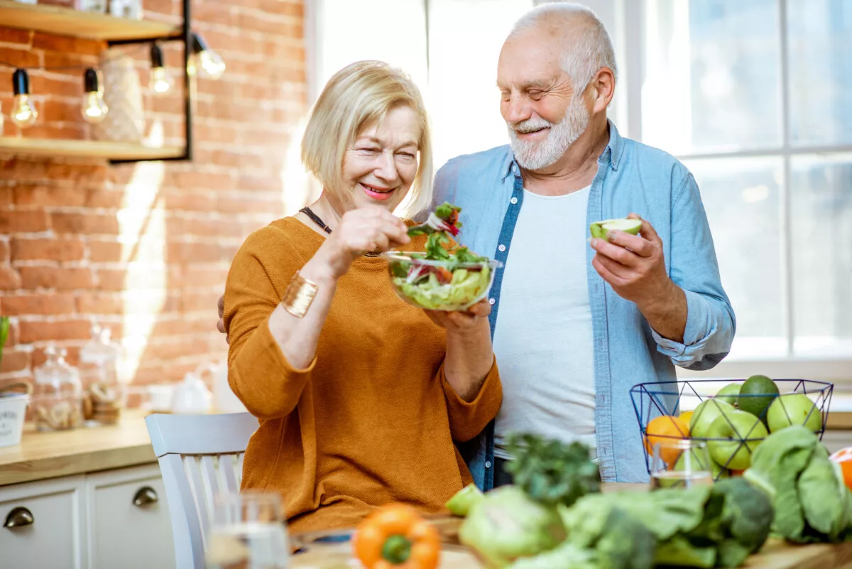 Older couple eating healthy salad 1200x801 jpeg